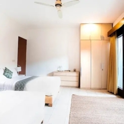 Asraya villa modern villa guest suite with separate twin beds built in wardrobe and direct access to a private outdoor garden area sanur 870x500