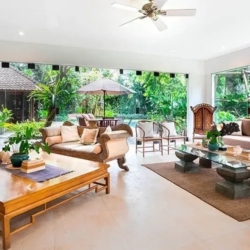 Asraya villa spacious open concept living room with comfortable seating modern television and garden access sanur 870x500
