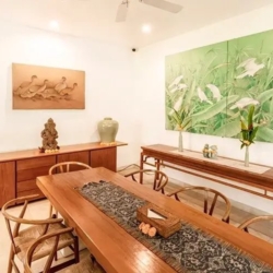 Asraya villa spacious tropical villa dining area showcasing traditional furniture unique artwork a console table and a cooling ceiling fan sanur 870x500