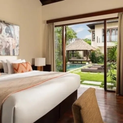 The suar spacious villa bedroom with a comfortable king bed and beautiful outdoor pool view seminyak 870x500