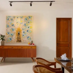 Villa ananya minimalist dining area with peacock artwork and modern bali furniture seminyak 870x500